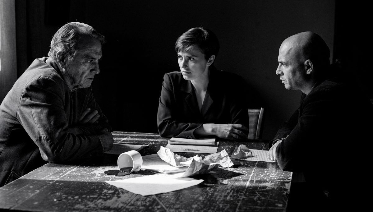 Three negotiators in tense standoff illustrating multi-party conflict dynamics