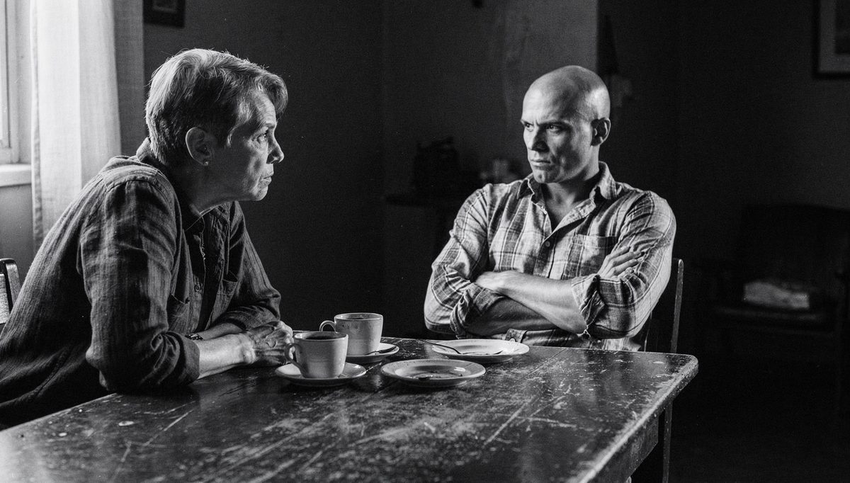 Two colleagues in tense conversation, team synergy mistakes visible
