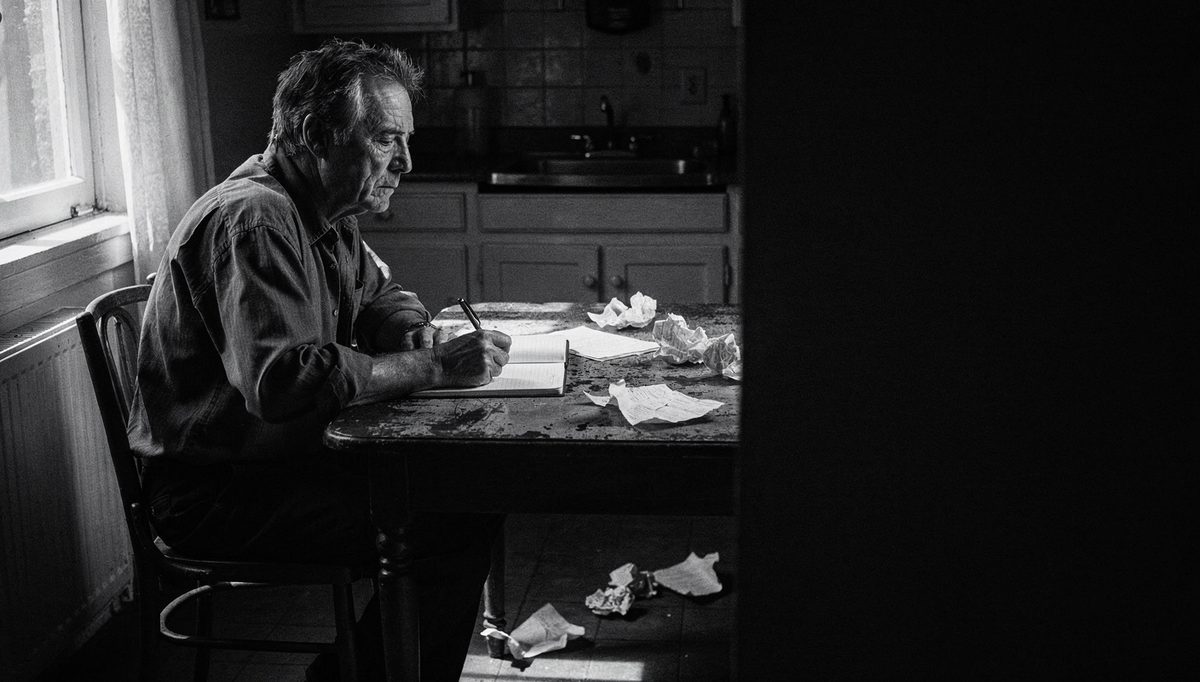 Man preparing with notebook, practicing conflict anxiety scripts alone