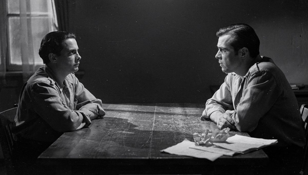 Two people in intense negotiation conflict across a table